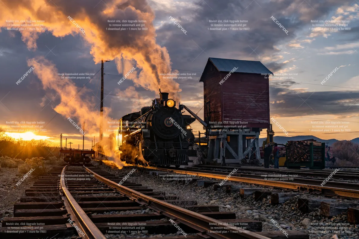 A dramatic scene of a steam locomotive set against a sunset sky, with railroad tracks and a water tower, evoking a sense of Baker City's historic roots and opportunities for exploration and adventure.